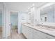 Bright bathroom featuring double vanity with granite countertops, and a walk-in shower at 4320 Bent Tree Blvd, Sarasota, FL 34241