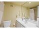 Well-lit bathroom features a clean vanity, mirror, and shower with curtain at 4320 Bent Tree Blvd, Sarasota, FL 34241