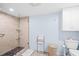 Bathroom featuring walk-in shower with glass door, toilet, and towels at 4320 Bent Tree Blvd, Sarasota, FL 34241