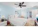 Comfortable bedroom featuring light blue walls, ceiling fan, and carpet at 4320 Bent Tree Blvd, Sarasota, FL 34241