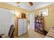 Bedroom featuring a dresser, white closet doors, and view of living space at 4320 Bent Tree Blvd, Sarasota, FL 34241