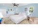 Light and airy bedroom with tranquil blue walls and cozy furnishings at 4320 Bent Tree Blvd, Sarasota, FL 34241