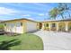 Inviting single-story home with a two-car garage and a well-maintained lawn at 4320 Bent Tree Blvd, Sarasota, FL 34241