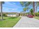 Charming single-story home with a well-manicured lawn and a long driveway, perfect for suburban living at 4320 Bent Tree Blvd, Sarasota, FL 34241