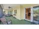 Enclosed patio area with chairs, table and view into kitchen at 4320 Bent Tree Blvd, Sarasota, FL 34241