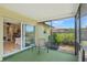 Enclosed patio with chair seating and view into the living room at 4320 Bent Tree Blvd, Sarasota, FL 34241