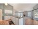 Eat-in kitchen with granite counters and breakfast bar overlooks a spacious living area at 4509 Diamond Cir, Sarasota, FL 34233