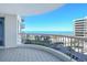View from the balcony looking out over the landscaping, beach, and ocean views at 455 Longboat Club Rd # 407, Longboat Key, FL 34228
