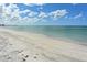 Expansive beach with light sand and serene turquoise water at 455 Longboat Club Rd # 407, Longboat Key, FL 34228