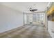 Bright bedroom with patterned carpet, neutral walls and large windows with partial city views at 455 Longboat Club Rd # 407, Longboat Key, FL 34228