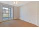 Bedroom with neutral carpet and private balcony access at 455 Longboat Club Rd # 407, Longboat Key, FL 34228