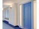 Condo entryway with a blue door and decorative glass panels to allow light to pass through at 455 Longboat Club Rd # 407, Longboat Key, FL 34228