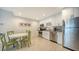 Modern kitchen features stainless steel appliances and a charming breakfast nook at 455 Longboat Club Rd # 407, Longboat Key, FL 34228