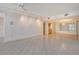 Large living room features tiled flooring, neutral walls, and recessed ceiling lights at 455 Longboat Club Rd # 407, Longboat Key, FL 34228