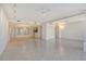 Spacious living room is illuminated with recessed lighting, ceiling fans, and decorative sconces at 455 Longboat Club Rd # 407, Longboat Key, FL 34228
