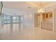 Large living space with tiled flooring features recessed lighting and balcony access at 455 Longboat Club Rd # 407, Longboat Key, FL 34228