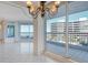 Bright, expansive living room with tile floors leads to the balcony at 455 Longboat Club Rd # 407, Longboat Key, FL 34228