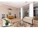 Elegant building lobby with marble floors, modern furniture, and natural light at 455 Longboat Club Rd # 407, Longboat Key, FL 34228