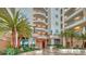 Elegant condo lobby with lush greenery and marble accents at 455 Longboat Club Rd # 407, Longboat Key, FL 34228