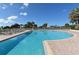 Large community pool with lounge chairs and ocean views, perfect for relaxation at 455 Longboat Club Rd # 407, Longboat Key, FL 34228