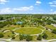 A wide-angle view shows off a large community park with recreational facilities and vast green space at 4954 Newport News Cir, Lakewood Ranch, FL 34211
