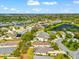 An aerial view shows a residence with a private fenced yard and a pond nearby at 4954 Newport News Cir, Lakewood Ranch, FL 34211