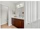 Bathroom featuring a double sink vanity and large mirror at 4954 Newport News Cir, Lakewood Ranch, FL 34211