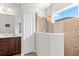 Bathroom featuring a glass-enclosed shower with tile surround and a dark wood vanity at 4954 Newport News Cir, Lakewood Ranch, FL 34211
