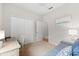 Bedroom offers a versatile space with a sofa, desk, and ample closet space at 4954 Newport News Cir, Lakewood Ranch, FL 34211