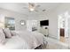 Bright bedroom with an ensuite bathroom and living room area at 4954 Newport News Cir, Lakewood Ranch, FL 34211