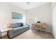 Cozy bedroom with sofa, desk, and chair, providing a comfortable and functional space with a nice view at 4954 Newport News Cir, Lakewood Ranch, FL 34211