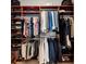Custom wood closet with ample shelves, rods, and storage space for shoes at 4954 Newport News Cir, Lakewood Ranch, FL 34211