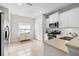 Efficient kitchen with white cabinets, modern appliances, and lots of natural light at 4954 Newport News Cir, Lakewood Ranch, FL 34211