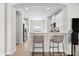 Kitchen view of breakfast bar, recessed lighting, stainless steel appliances and white cabinetry at 4954 Newport News Cir, Lakewood Ranch, FL 34211