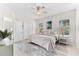 Bright bedroom with large windows, closet, and en-suite bathroom at 4954 Newport News Cir, Lakewood Ranch, FL 34211