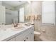 Bright bathroom featuring a sliding glass door shower and a large single sink vanity at 5087 Timber Chase Way, Sarasota, FL 34238