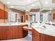 Modern bathroom featuring double vanities, large mirror, soaking tub, and separate shower at 5087 Timber Chase Way, Sarasota, FL 34238