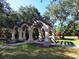 Picturesque park area with a gazebo and mature trees at 5087 Timber Chase Way, Sarasota, FL 34238