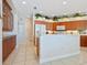 Spacious kitchen with wood cabinets and a large center island at 5087 Timber Chase Way, Sarasota, FL 34238