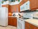 Kitchen features stone countertops and appliances at 5087 Timber Chase Way, Sarasota, FL 34238