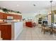 Open-concept kitchen, dining, and living area, with a fireplace at 5087 Timber Chase Way, Sarasota, FL 34238