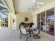 Inviting outdoor patio with a dining area and a view of the landscaped yard and pool area at 5087 Timber Chase Way, Sarasota, FL 34238
