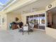 Charming outdoor patio with a table and chairs, perfect for al fresco dining and entertaining at 5087 Timber Chase Way, Sarasota, FL 34238