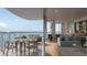 Elegant living space with access to a dining space and a balcony with harbor views at 550 Golden Gate Point # 304, Sarasota, FL 34236