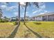 Spacious backyard with well-manicured lawn and view of condominium buildings at 5753 Summer Side Ln # 8A, Sarasota, FL 34231