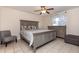 Neutral bedroom with a ceiling fan and a large dresser at 5753 Summer Side Ln # 8A, Sarasota, FL 34231