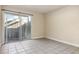 Empty bedroom with sliding glass doors to a private patio at 5753 Summer Side Ln # 8A, Sarasota, FL 34231
