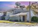 Charming townhome featuring a quaint patio and neutral exterior paint at 5753 Summer Side Ln # 8A, Sarasota, FL 34231