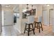 Kitchen bar with pendant lights, updated cabinets and countertops at 5753 Summer Side Ln # 8A, Sarasota, FL 34231