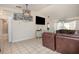 Bright living room with tile floors and modern lighting at 5753 Summer Side Ln # 8A, Sarasota, FL 34231